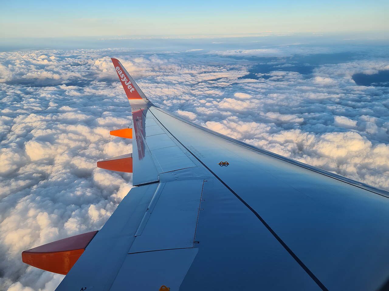 A beautiful wing view, surfing the clouds above the UK.